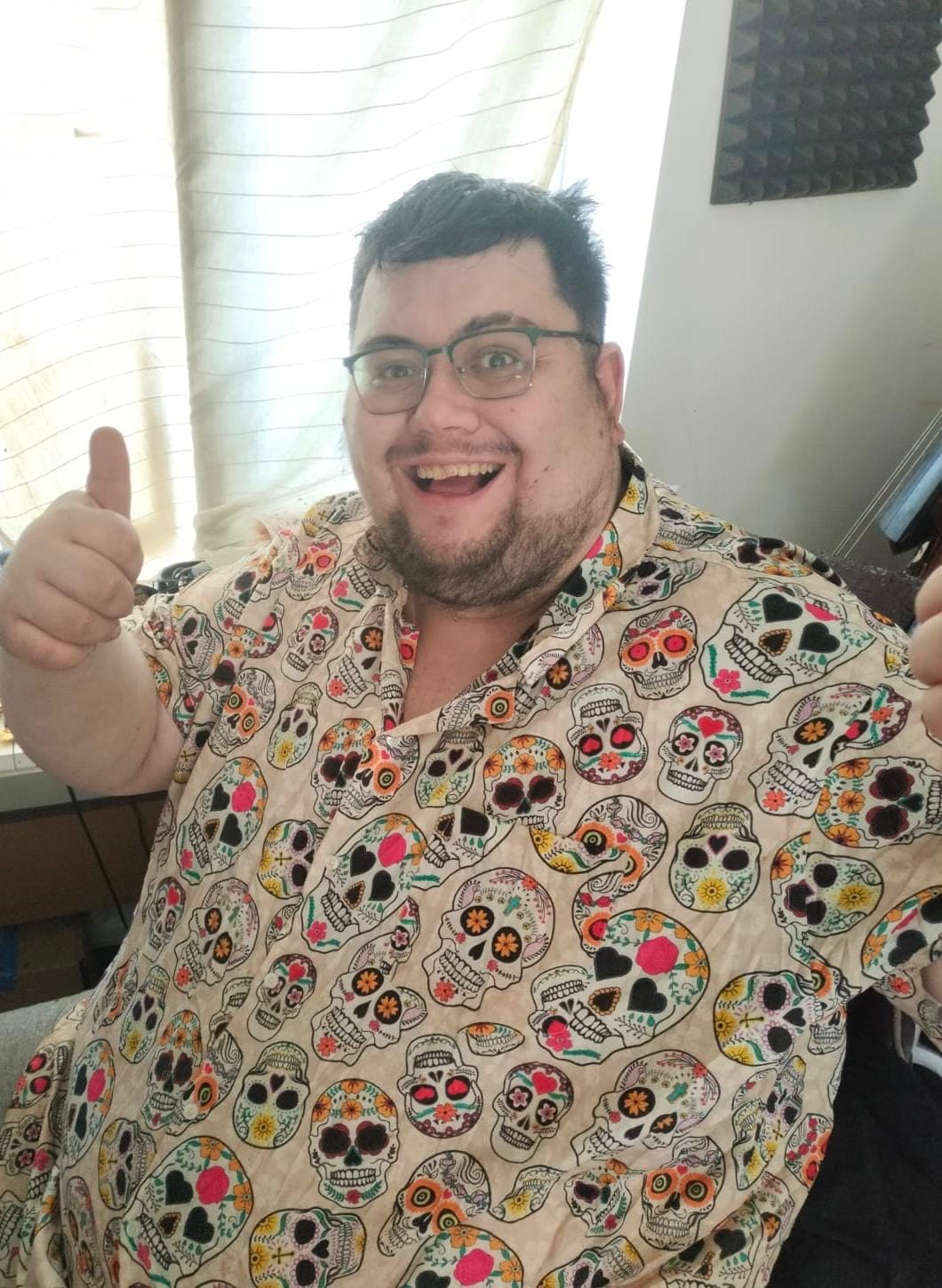 Oliver Morris in a cool shirt covered with "Day of the Dead" style skulls